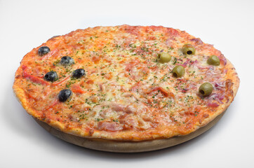 Pizza four seasons. Pizza is divided into four sectors. The composition includes: ham, olives, olives, champignon mushrooms, tomatoes, tomato. Served on a wooden round board. Shot on a white backgroun