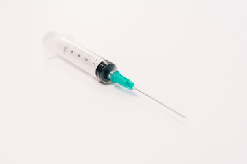 Syringe on a white background.