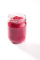 Nutrition concept - Healthy food, Diet, Detox, Clean Eating or Vegetarian concept. A nutritious food on glass jars against white background. Sauce in a glass bowl.