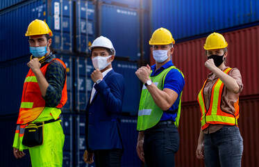 Industrial workers or engineers wearing Coronavirus or COVID-19 protective masks