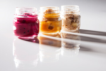 Nutrition concept - Healthy food, Diet, Detox, Clean Eating or Vegetarian concept. A glass jar of nutritious food against white background. Delicious take away food in glass jars.