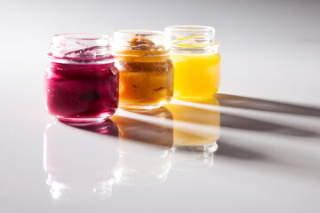 Nutrition concept - Healthy food, Diet, Detox, Clean Eating or Vegetarian concept. A glass jar of nutritious food against white background. Delicious take away food in glass jars.