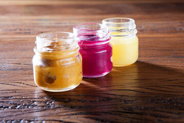 Nutrition concept - Healthy food, Diet, Detox, Clean Eating or Vegetarian concept. A glass jar of nutritious food against wooden background. Delicious take away food in glass jars.