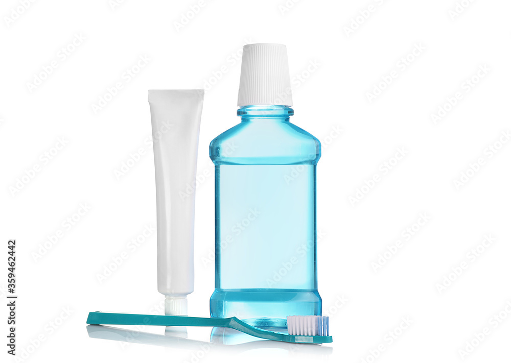 Wall mural Mouthwash, toothpaste in white tube and toothbrush