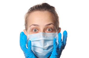 Portrait of panicking woman in medical mask and latex gloves.