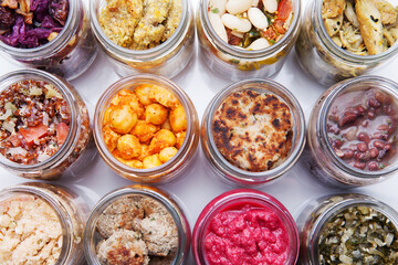 Nutrition concept - Healthy food, Diet, Detox, Clean Eating or Vegetarian concept. A glass jar of nutritious food against white background. Delicious take away food in glass jars.