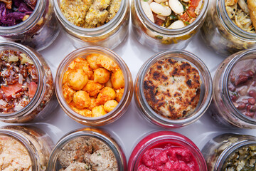 Nutrition concept - Healthy food, Diet, Detox, Clean Eating or Vegetarian concept. A glass jar of nutritious food against white background. Delicious take away food in glass jars.