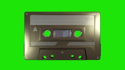 Obraz premium A golden music cassette on a green screen background. 3d rendering