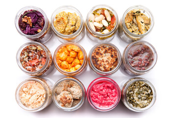 Nutrition concept - Healthy food, Diet, Detox, Clean Eating or Vegetarian concept. A glass jar of nutritious food against white background. Delicious take away food in glass jars.
