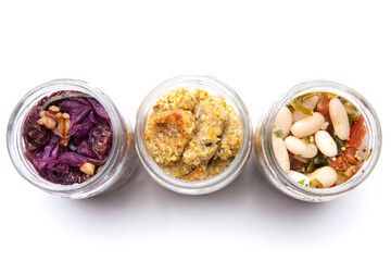 Nutrition concept - Healthy food, Diet, Detox, Clean Eating or Vegetarian concept. A glass jar of nutritious food against white background. Delicious take away food in glass jars.