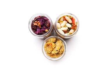 Nutrition concept - Healthy food, Diet, Detox, Clean Eating or Vegetarian concept. A glass jar of nutritious food against white background. Delicious take away food in glass jars.