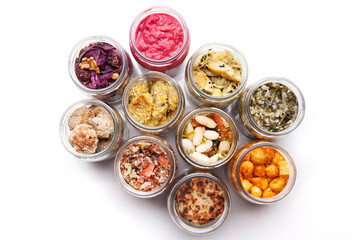 Nutrition concept - Healthy food, Diet, Detox, Clean Eating or Vegetarian concept. A glass jar of nutritious food against white background. Delicious take away food in glass jars.