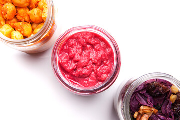 Nutrition concept - Healthy food, Diet, Detox, Clean Eating or Vegetarian concept. A glass jar of nutritious food against white background. Delicious take away food in glass jars.