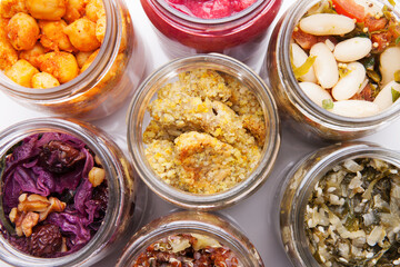 Nutrition concept - Healthy food, Diet, Detox, Clean Eating or Vegetarian concept. A glass jar of nutritious food against white background. Delicious take away food in glass jars.