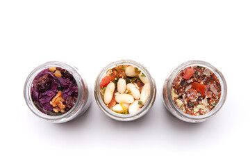 Nutrition concept - Healthy food, Diet, Detox, Clean Eating or Vegetarian concept. A glass jar of nutritious food against white background. Delicious take away food in glass jars.