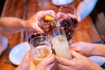 People toasting with drinks