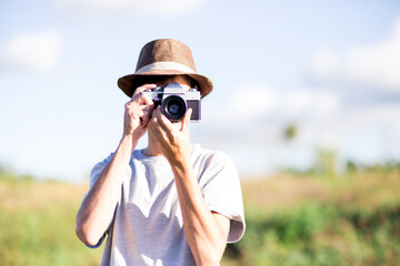 Photographer. Tourist or photographer taking photographs with his camera.