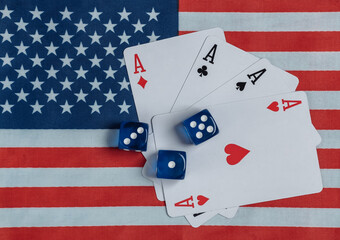 Four aces and dice on the background of the USA flag.