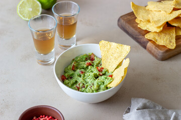 Mexican dip sauce guacamole with nachos chips. Mexican food. Healthy eating. Vegetarian food.