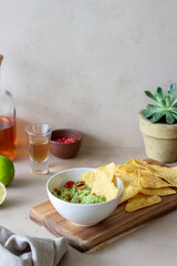 Mexican dip sauce guacamole with nachos chips. Mexican food. Healthy eating. Vegetarian food.