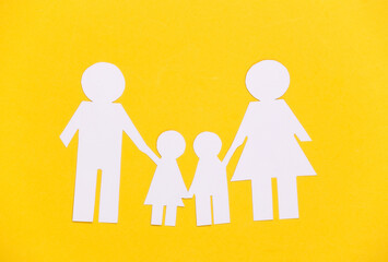 Paper happy family together on yellow background.