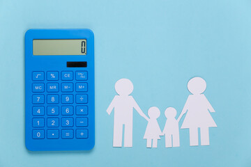 Paper happy family together with calculator on blue background. Calculation of family expenses, budget