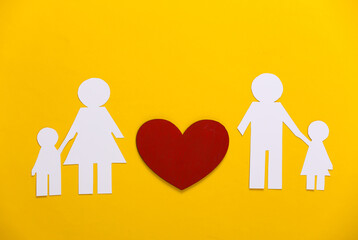 Resume Relationship Concept. Paper family with a red heart on a yellow background