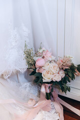 Beautiful wedding bouquet. Delicate petals of white and red roses.