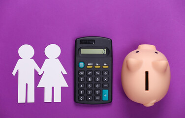 Calculation of the family budget concept. Paper couple in love together, calculator and piggy bank on purple background.