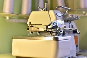 light sewing machine with needle and thread at the working level