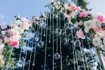 Wedding flower decorations from roses. Decoration for the ceremony.