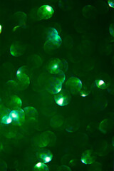 Abstract shiny bokeh background in green colors for design