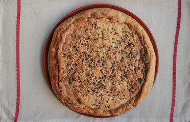 Ruddy quiche pie on tablecloths