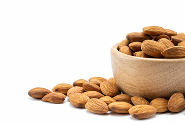Almonds in wooden bowl isolated on white background