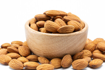 Almonds in wooden bowl isolated on white background