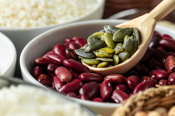 White ceramic bowls with assorted grains on kitchen table