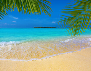 palm leaves over a sandy tropical beach, turquoise sea and island in the background, Maldives