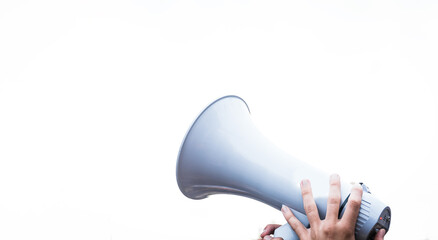 Person shouting with a megaphone at a demonstration for freedom and equality. Protesting activist.