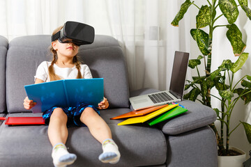 Young little girl with VR virtual reality glasses