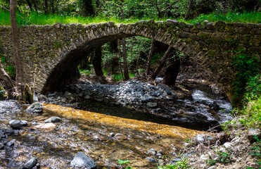 Ancient stone Venetian bridge in the Troodos mountains on the island of Cyprus.