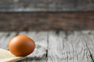 Close-up view of raw eggs isolated on Brown background.