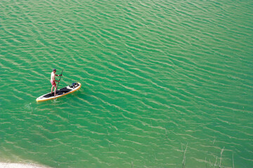 stand up paddleboarding in a lake