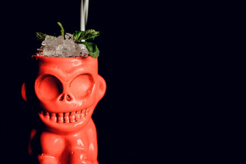 tiki cocktail with mint in a beautiful state on a dark background