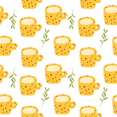 Seamless pattern with yellow cups of tea with milk and a green branch. Vector illustration isolated on a white background.