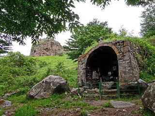 Ruins of church on Stone Forest hills, that surrounding town Goris in Armenia. Though building of church was ruined during earthquake, local people still take care of sacred altar's remains
