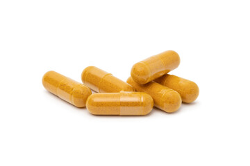  dry Turmeric powder in capsule  isolated on white background.
