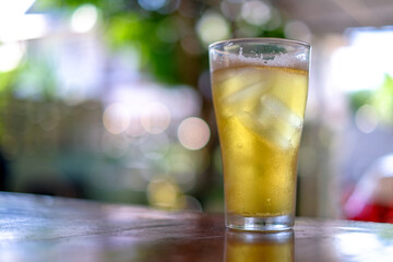 glass of beer on wooden table