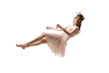 Mid-air beauty cought in moment. Full length shot of attractive young woman hovering in air and...