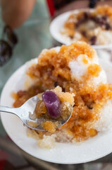 eating shaved ice with colorful dessert