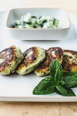 vegan lentils burgers with cucumber salad and mint